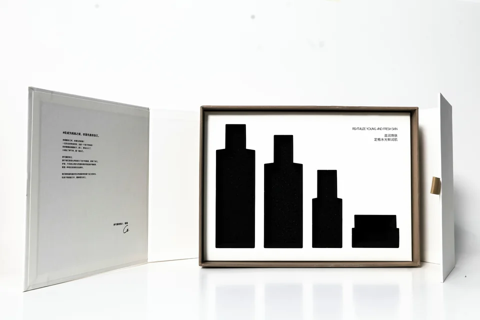 Printed skincare gift box, open, with a fitted insert