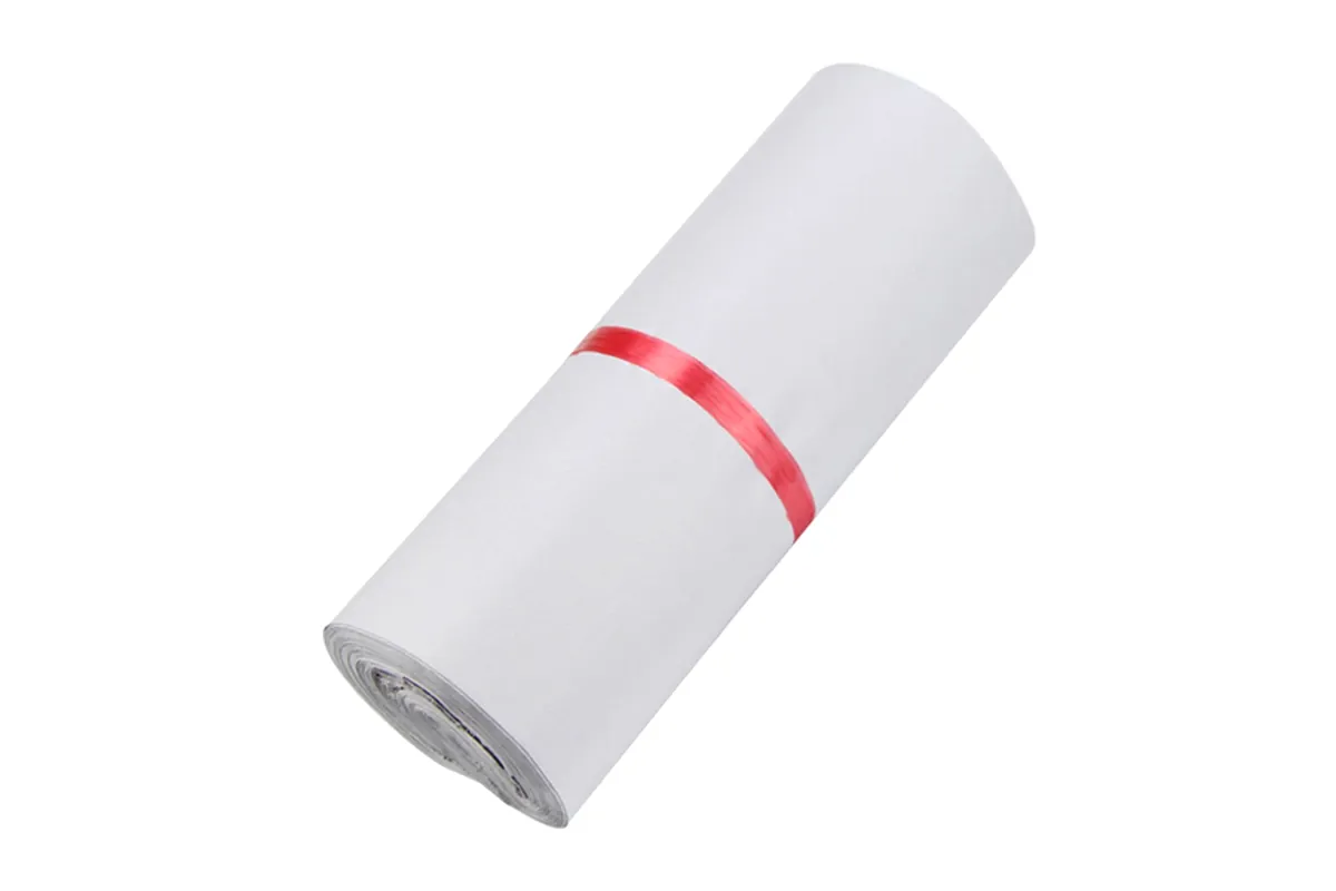 Roll of white embossed courier bags with a red band