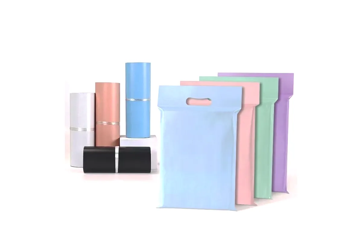 Handled poly mailers in blue, pink, mint and lilac beside rolled mailers in white, peach, blue and black