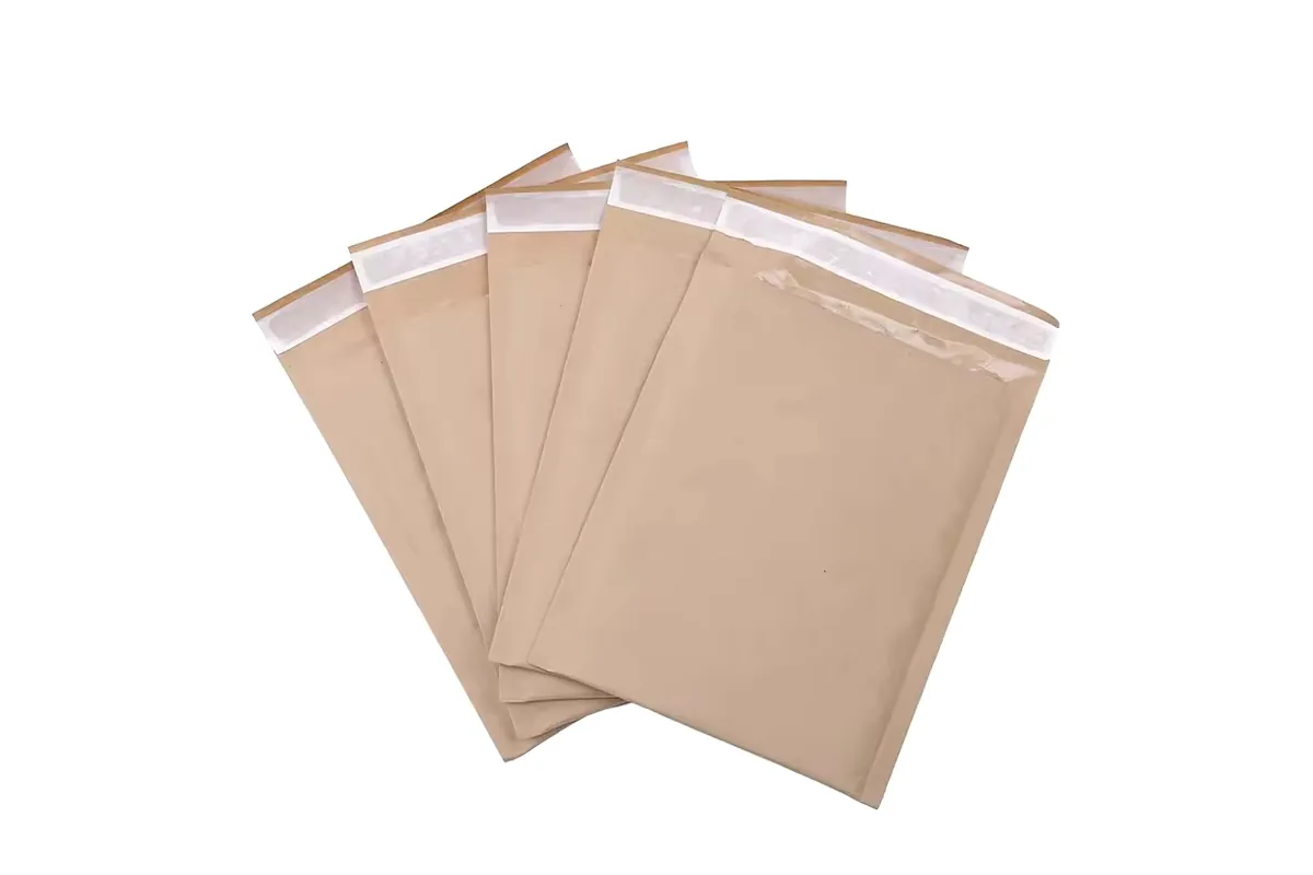 Five kraft bubble mailers fanned out, each with a white peel-off seal strip