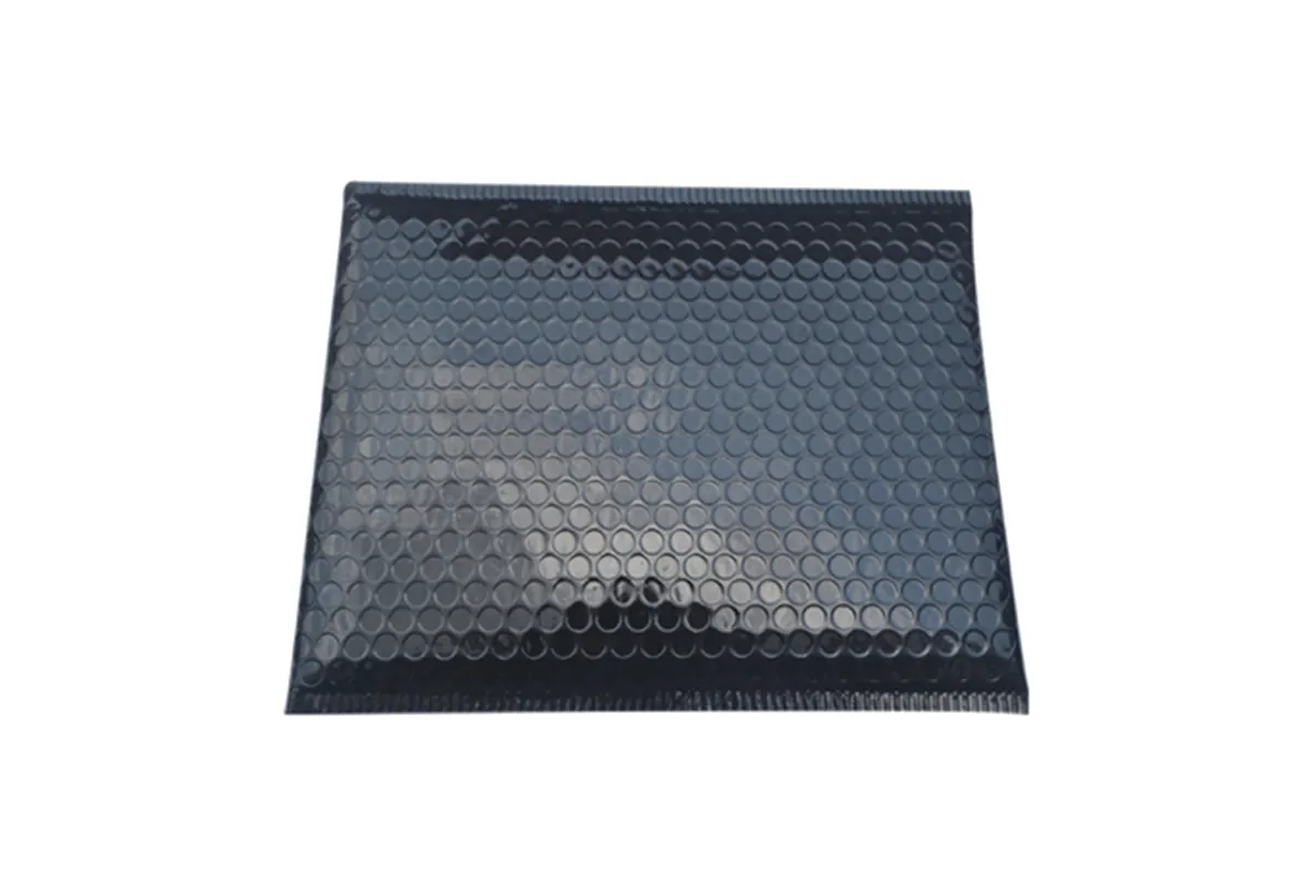 Black metallic bubble mailer laid flat, showing the bubble pattern
