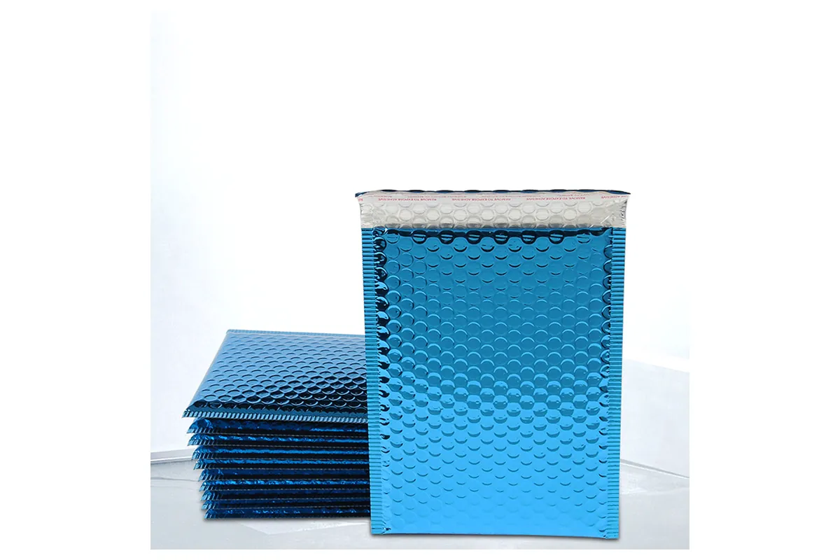 Blue metallic bubble mailers, one standing in front of a stack