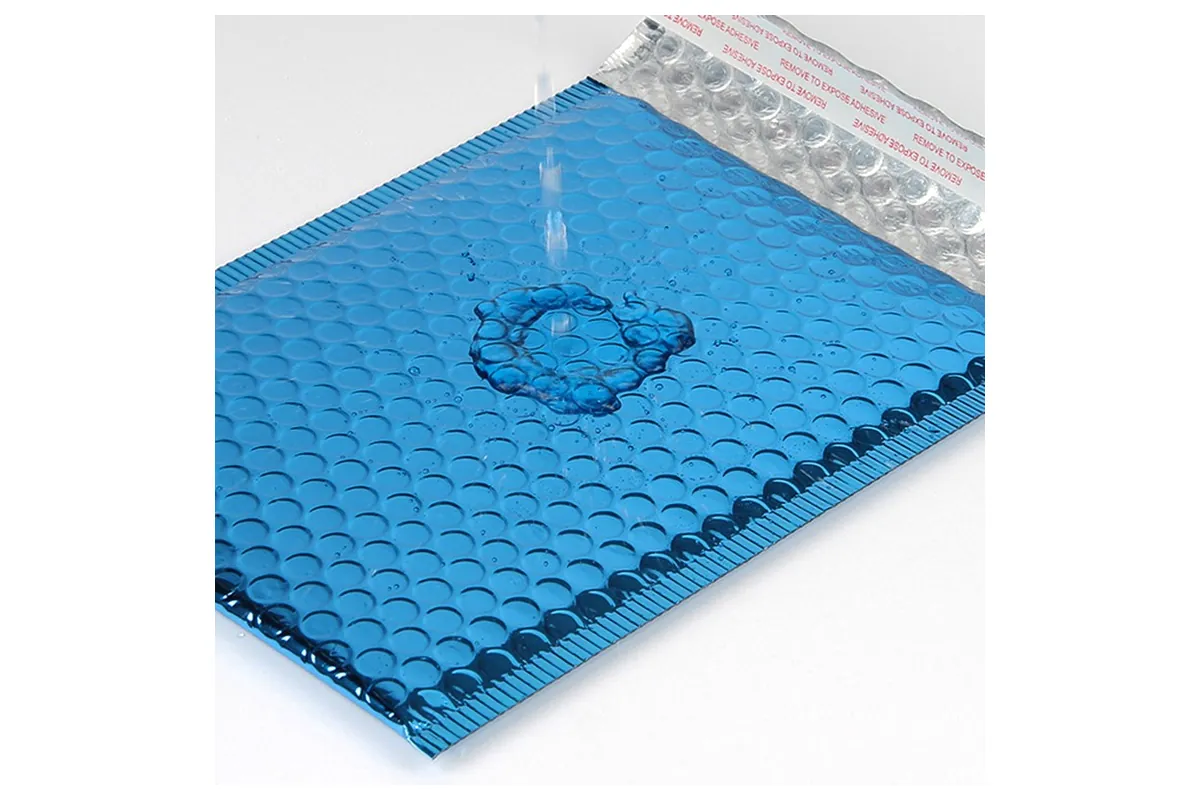 Water pooling on the surface of a blue metallic bubble mailer