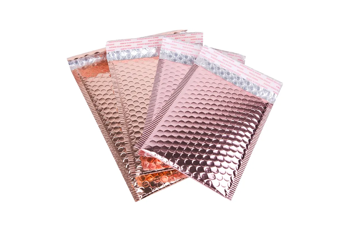 Four pink pearlescent bubble mailers fanned out, with peel-off seal strips