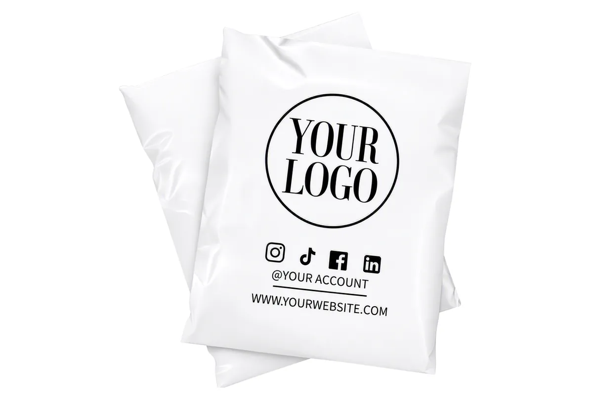 White poly mailers custom printed with a black logo, social media icons and website address