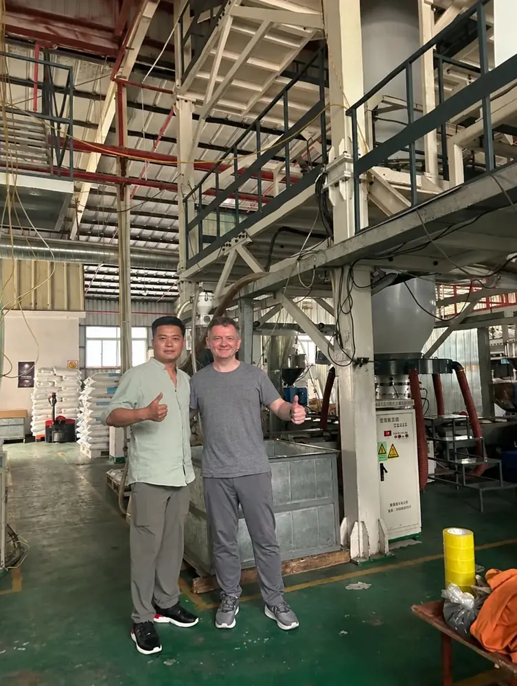 Noel and Josh giving a thumbs up beside the film blowing tower