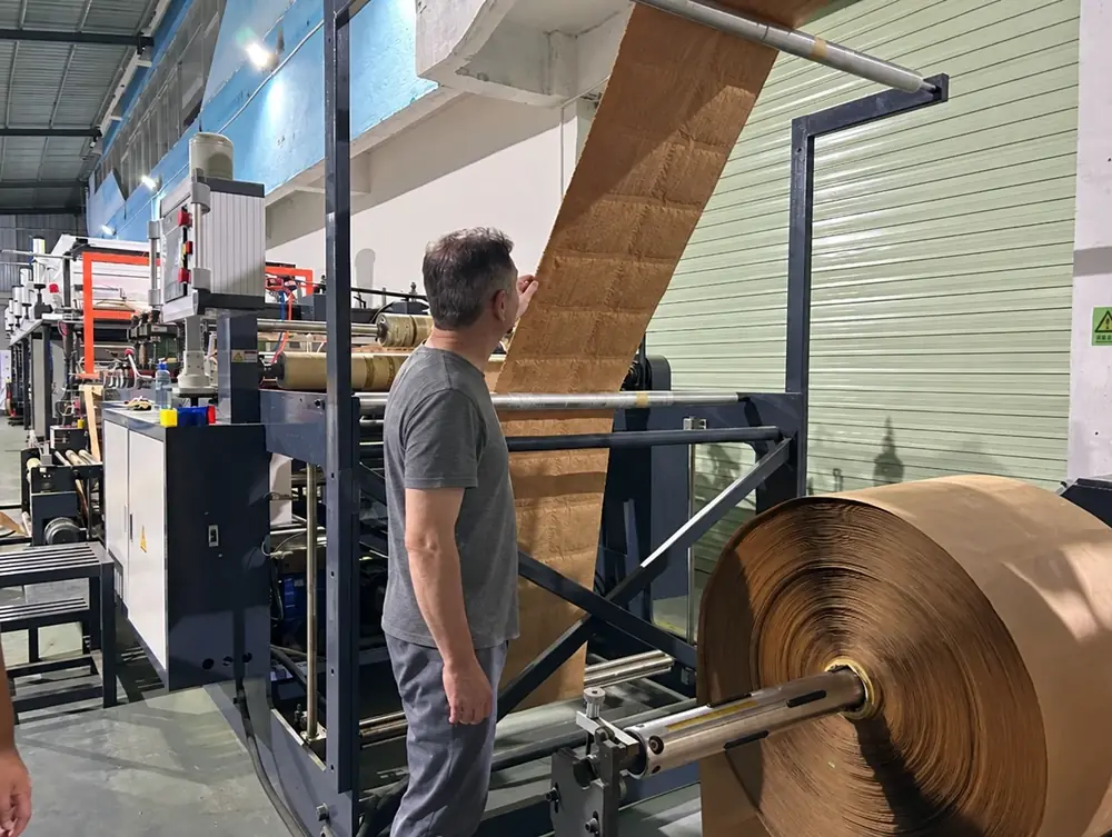 Noel checking kraft paper on a production line at our Dongguan factory